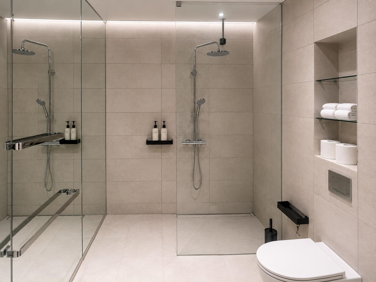 Walk-in shower with rainfall head and fresh towels