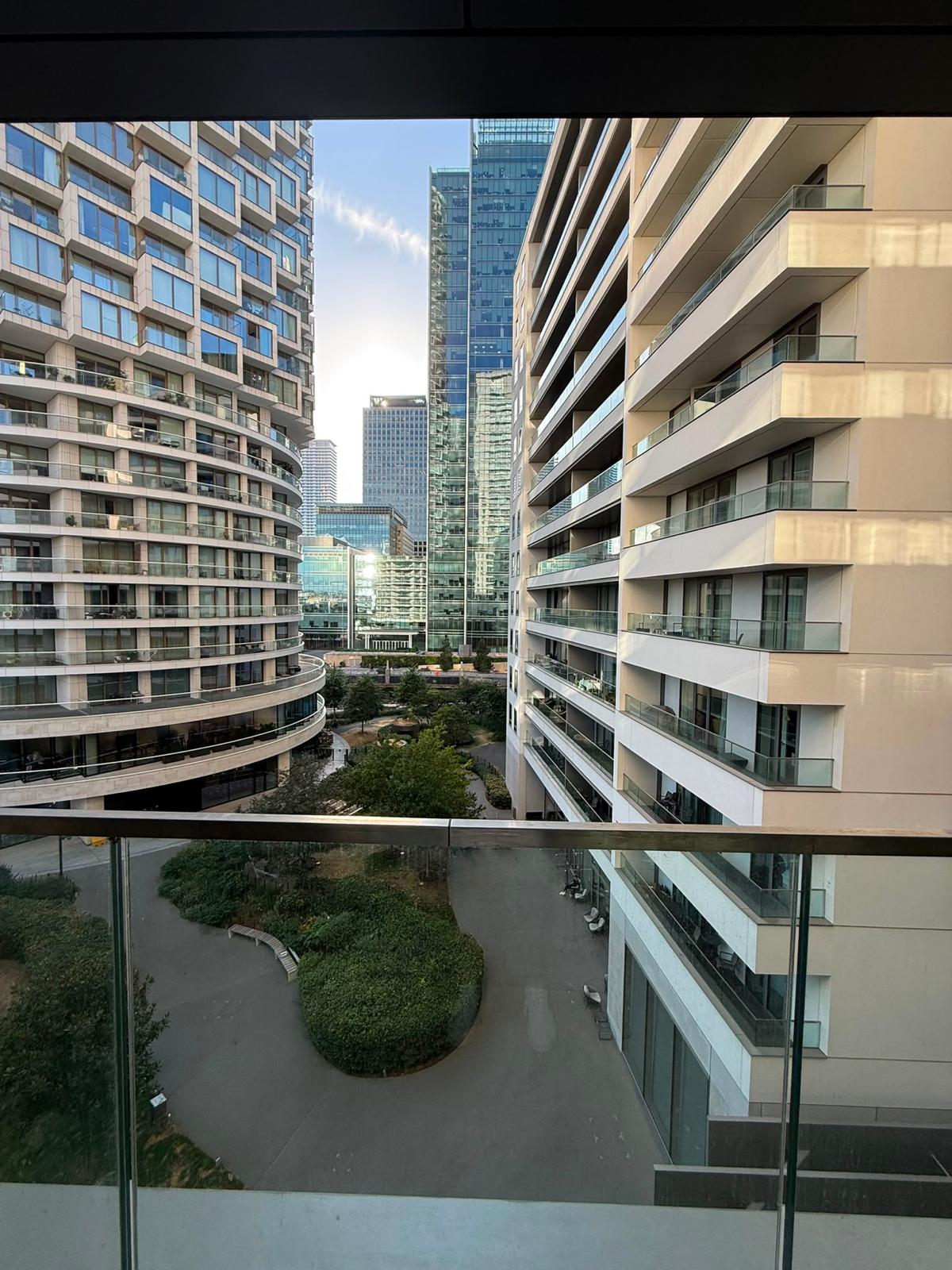Balcony view across Wood Wharf gardens towards the Canary Wharf skyline
