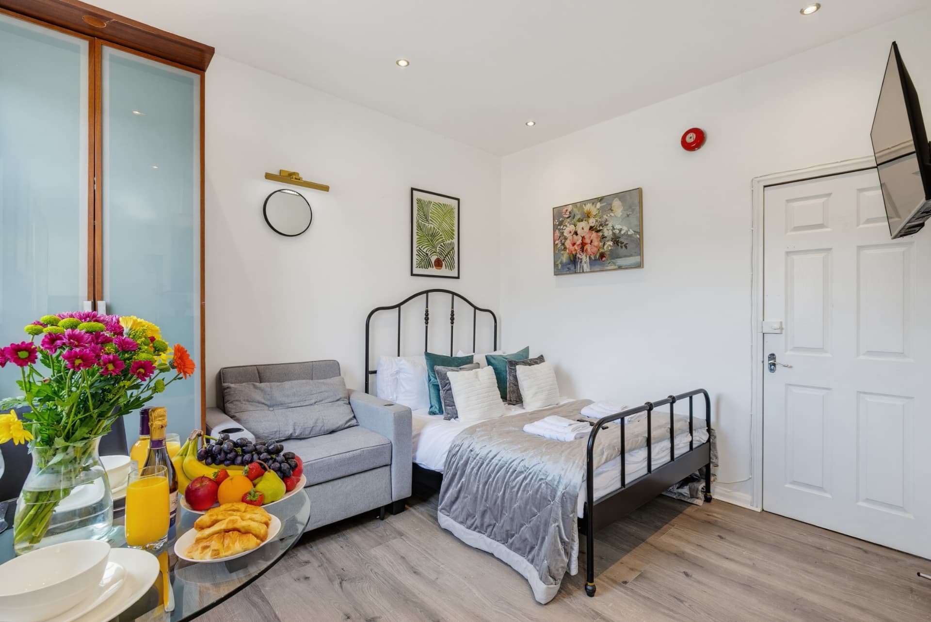 Double bed and sofa in the Islington serviced studio